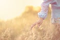 Close up girlÃ¢â¬â¢s hand on grass flower field. scenery scene,feeling freedom Royalty Free Stock Photo